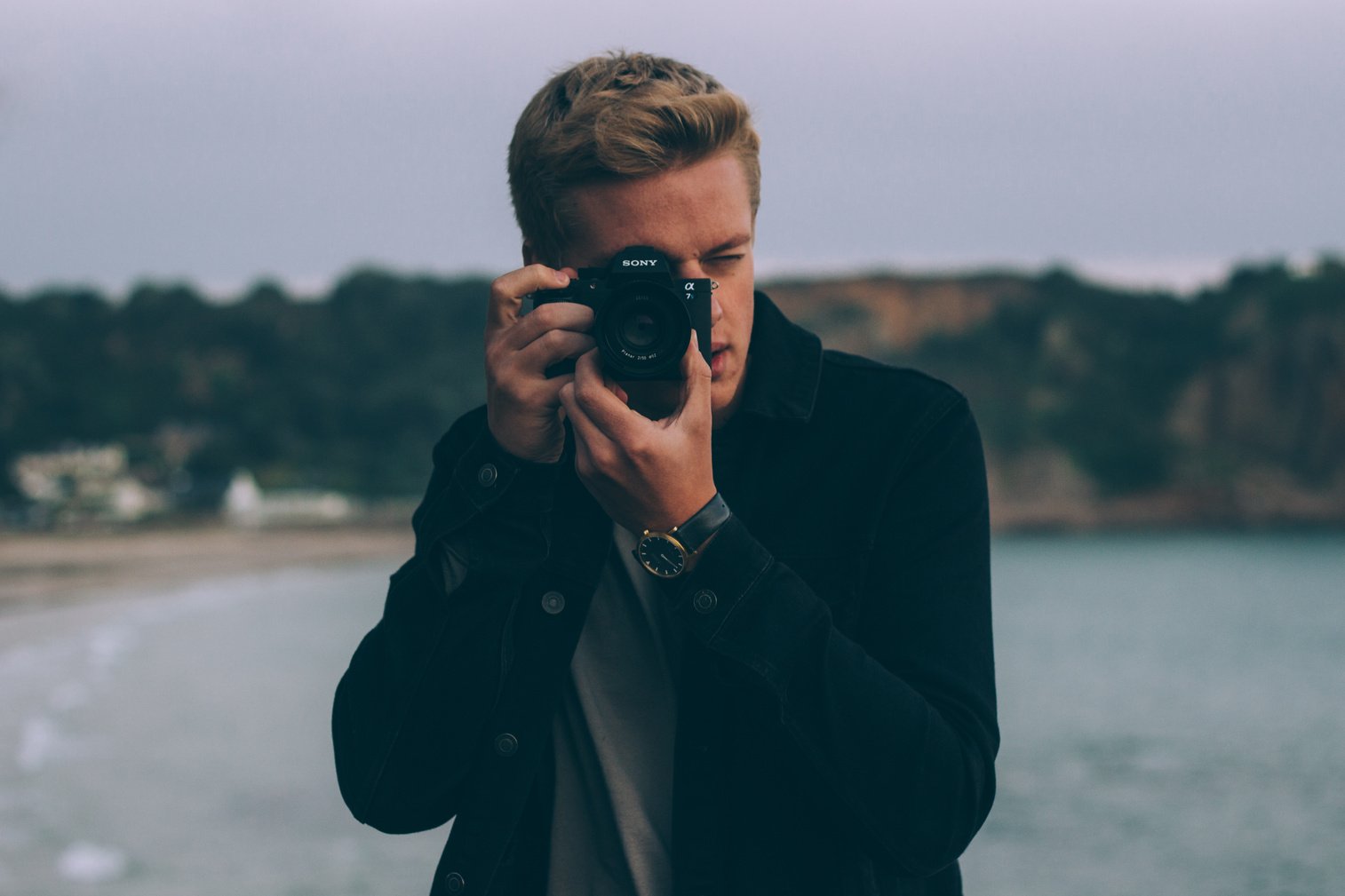 Man Using Camera at the Beach